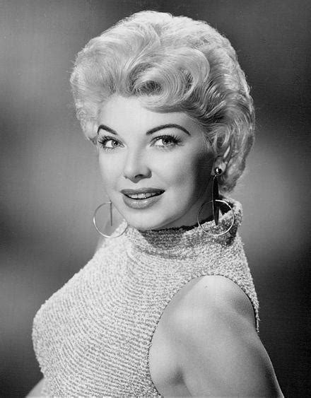 Discover Barbara Nichols' stature in feet