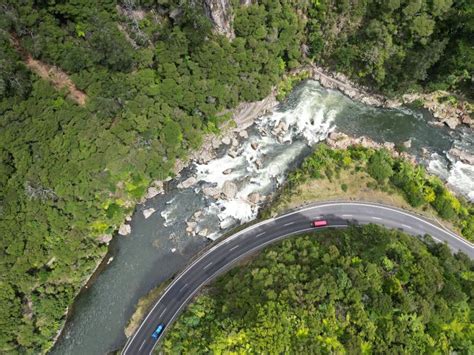 The Irresistible Allure of Imagining Driving a Vehicle into the Tranquil Waters of a Majestic River