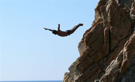 The Thrill of Leaping: Fascinating Dreams of Soaring from Great Heights into Aquatic Depths