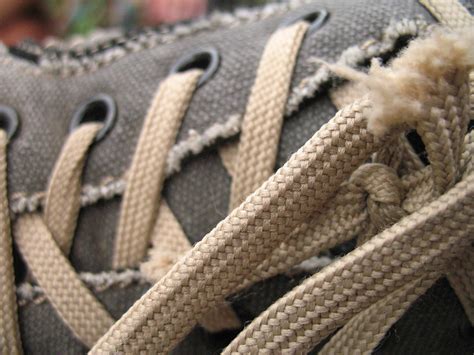 Unveiling the Symbolism of Frayed Laces: Challenges and Barriers